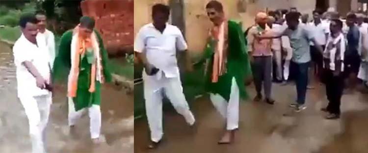 বিজেপির  বিধায়ককে নোংরা পানিতে খালি পায়ে হাঁটিয়েছেন বিক্ষুব্ধ গ্রামবাসী